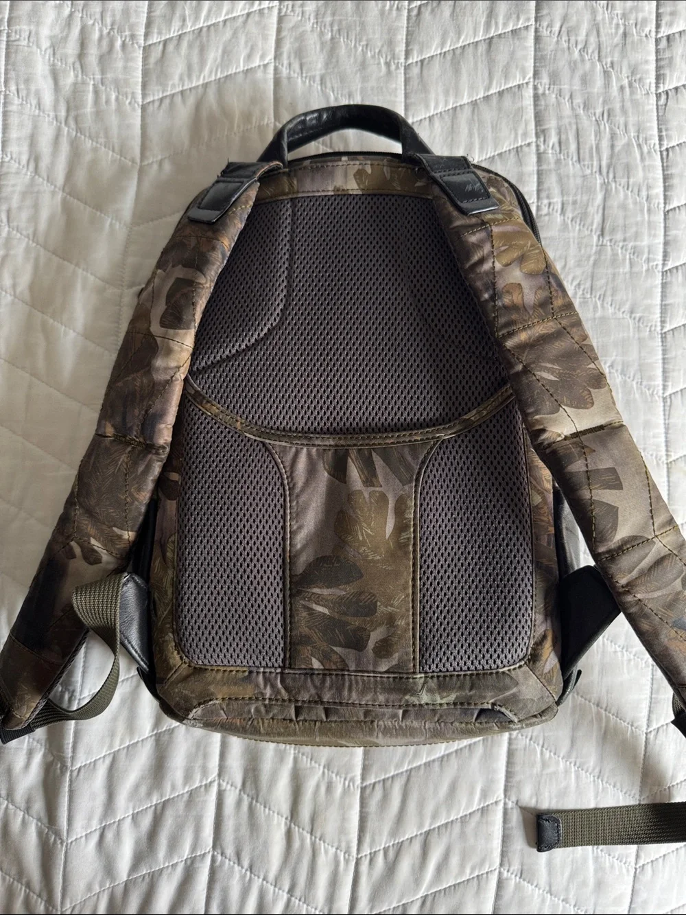 Tumi Black Leather and Brown Leaf-Print Backpack USED